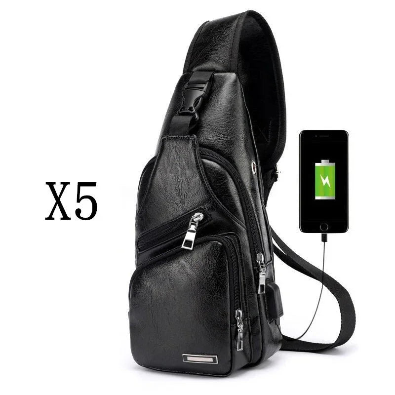 Black leather sling backpack with multiple zippers and USB charging port connected to phone
