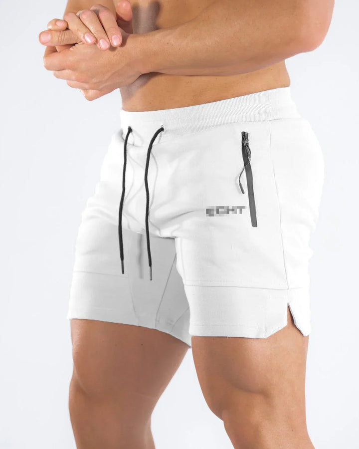 Close-up of muscular man wearing white athletic shorts with black drawstrings and zippered pocket