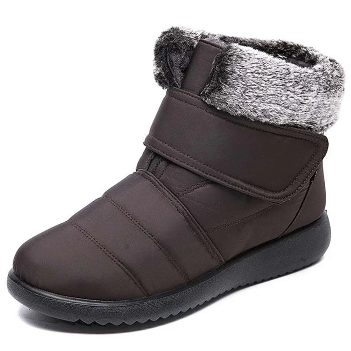 brown winter boot with faux fur lining and Velcro strap on black sole