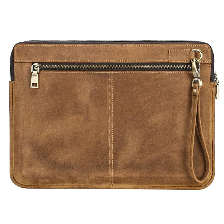 Brown leather zippered wristlet pouch with metal hardware and detachable strap