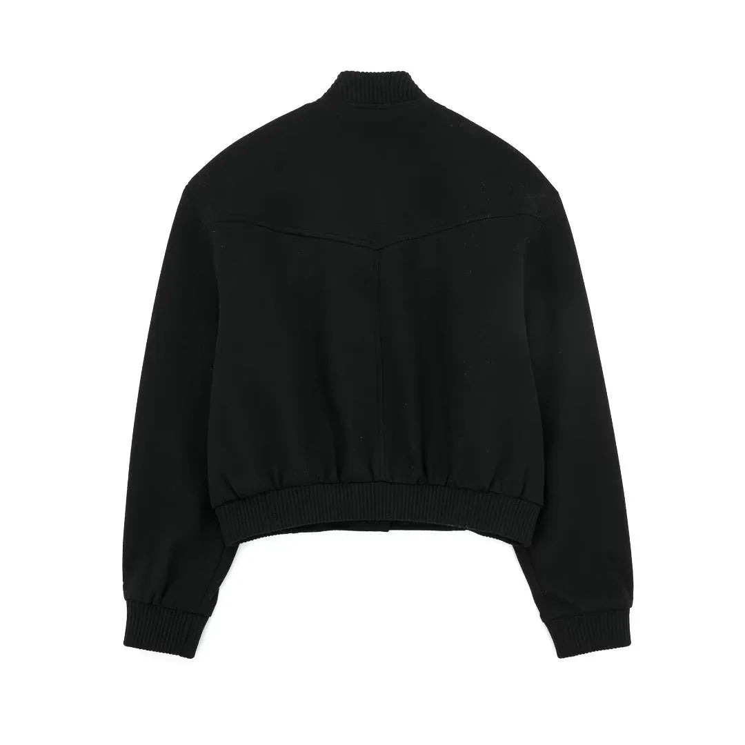 Back view of a black ribbed collar and cuff jacket with elastic waistband on white background
