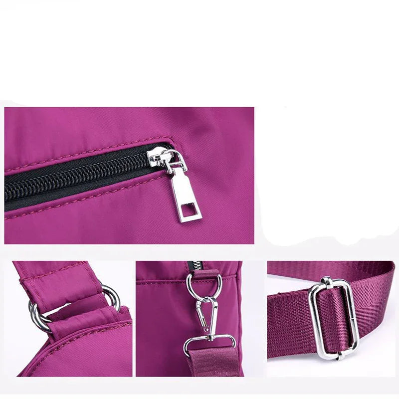 Close-up details of purple nylon bag with silver zipper, strap buckle, and metal hooks