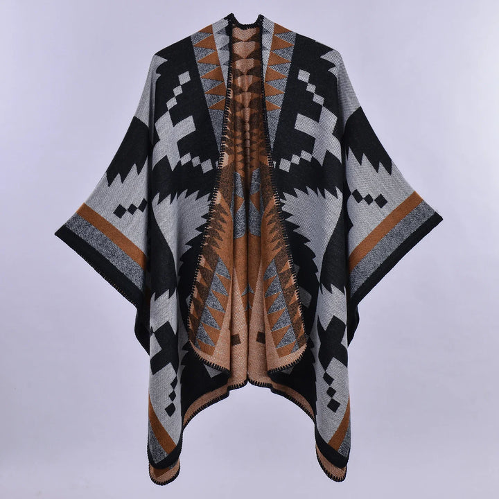 Black, gray, and brown poncho with geometric Aztec-inspired pattern and wide sleeves