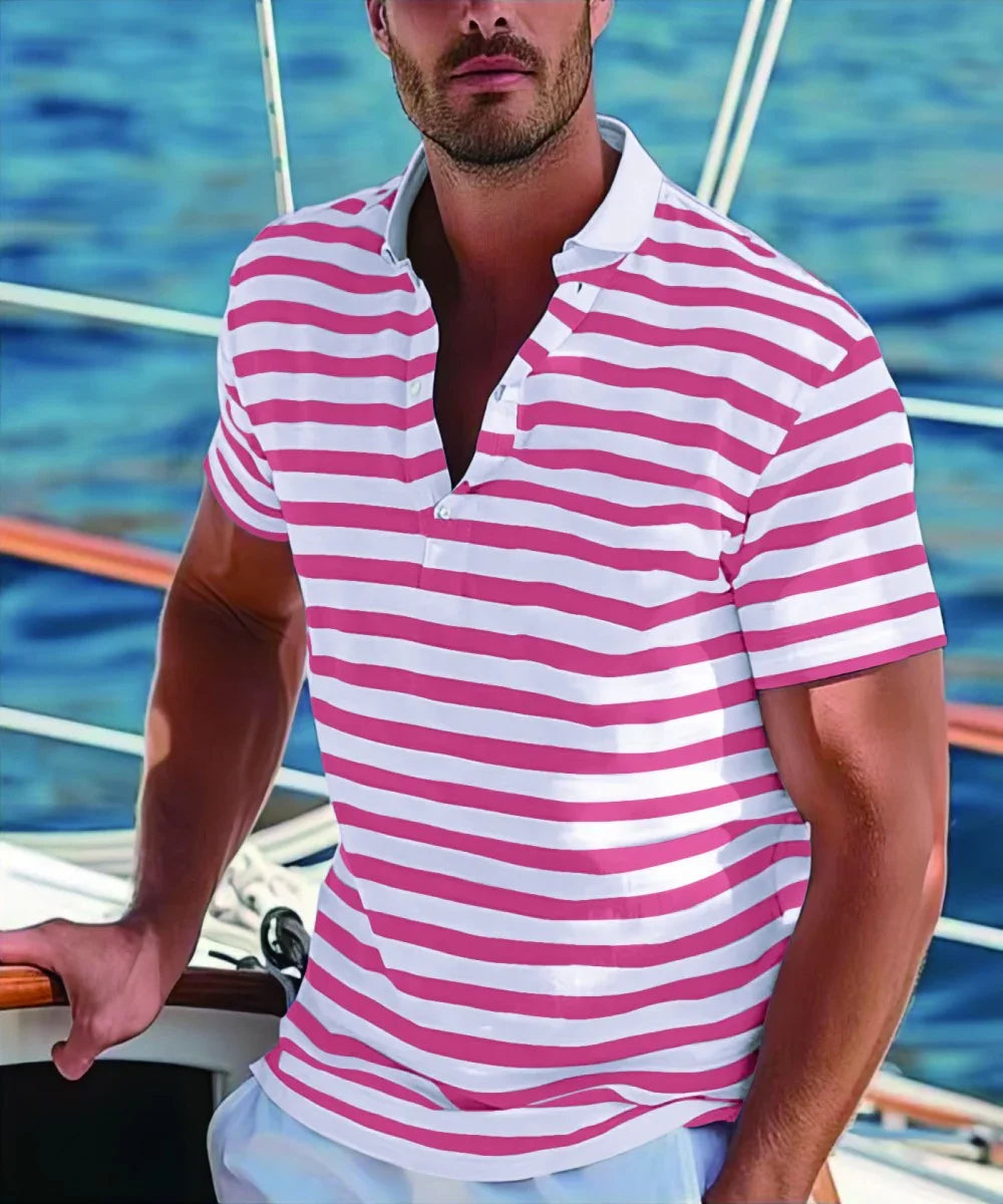 Man wearing white and pink striped polo shirt on a boat with blue water background
