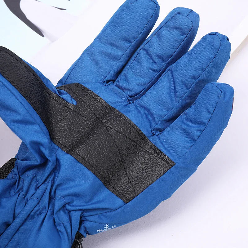 Blue winter glove with black textured palm grip, insulated for cold weather protection
