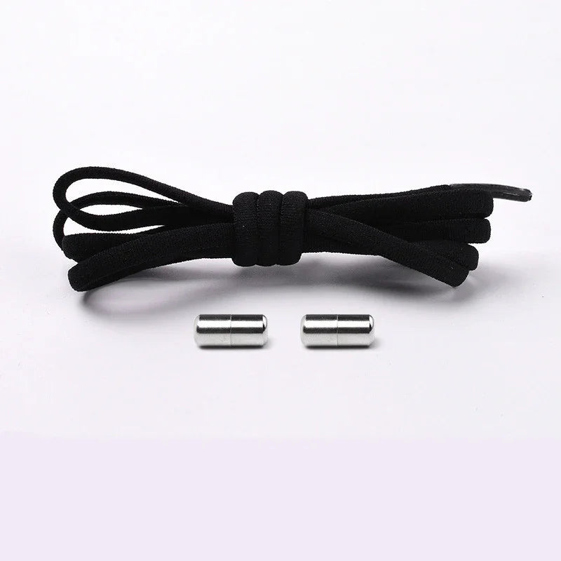 Black shoelace with two silver metal aglets on white background