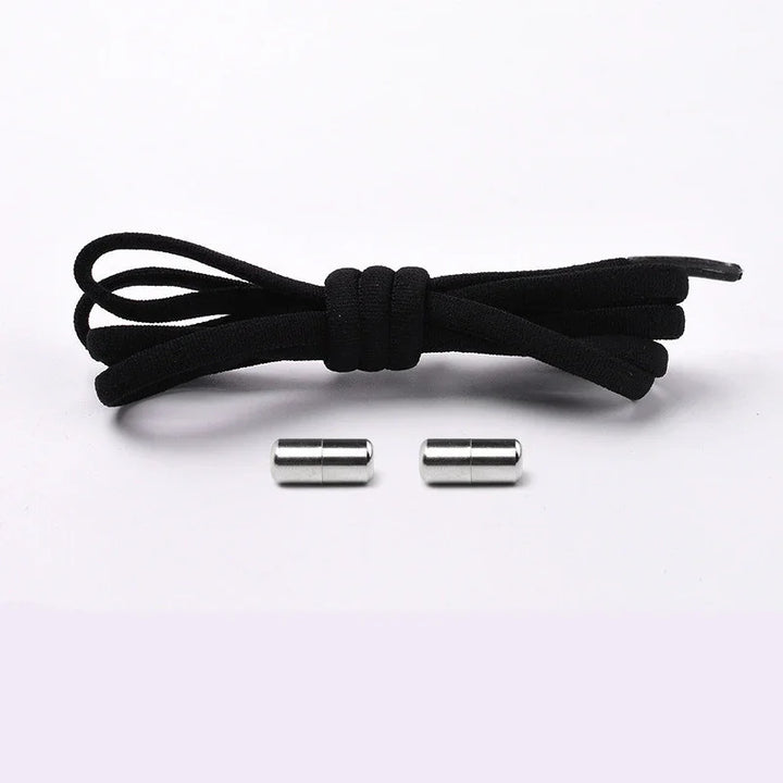 Black shoelace with two silver metal aglets on white background