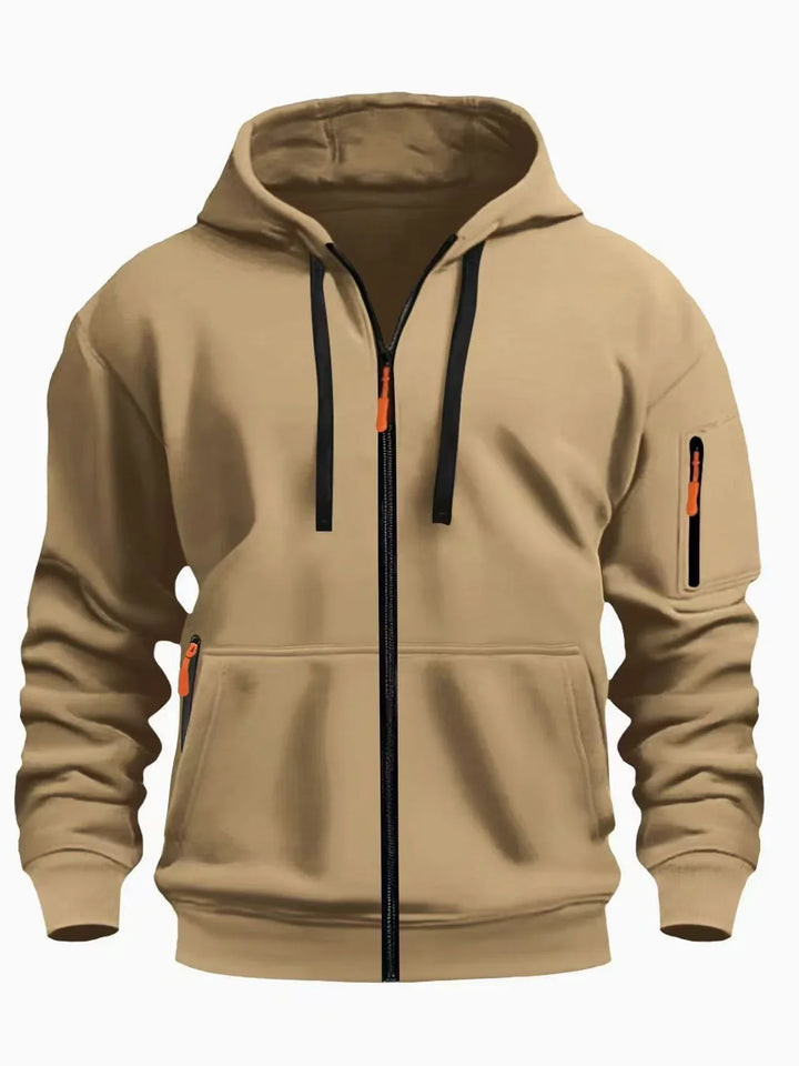 Beige full-zip hoodie with black drawstrings and orange zipper pulls, featuring front and sleeve pockets