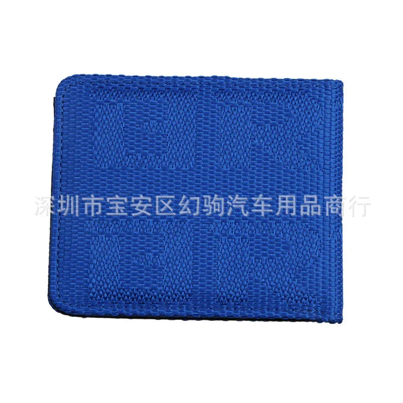 Blue woven fabric wallet with textured geometric pattern on white background