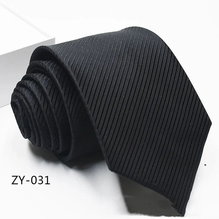 Black ribbed textured men's necktie rolled on white surface with code ZY-031