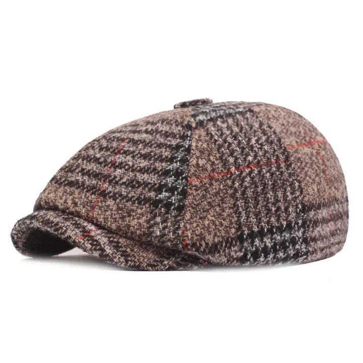 Brown plaid flat cap with red and black checkered pattern on white background