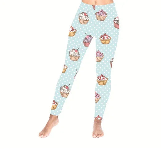 Light blue leggings with white polka dots and colorful cupcake pattern, worn on model legs