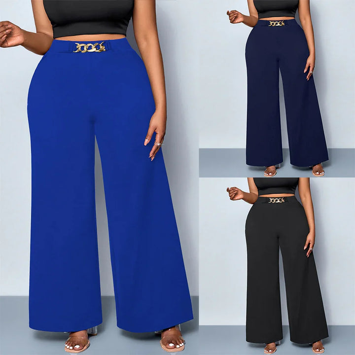 Women wearing high-waist wide-leg pants in blue, navy, and black with gold chain belt detail