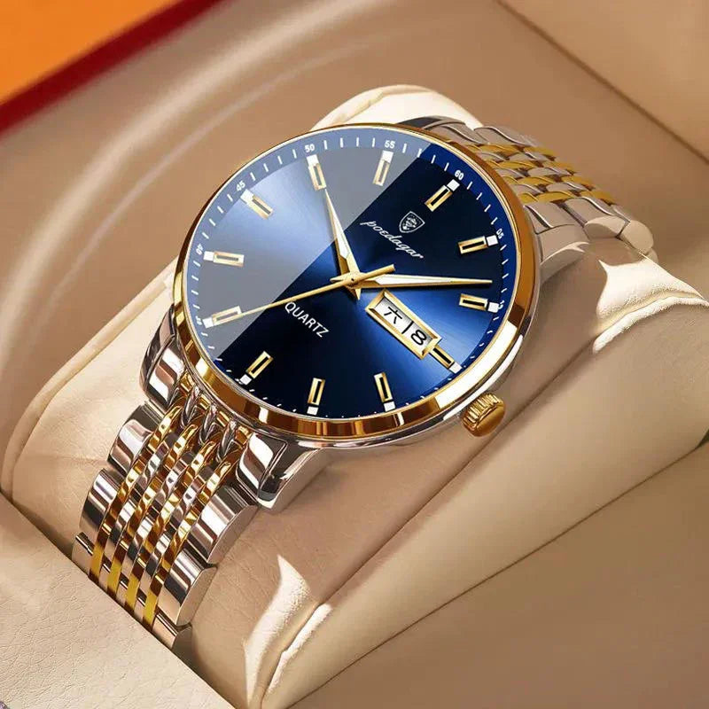 Luxury men's quartz wristwatch with blue dial, gold accents, date display, and two-tone metal band