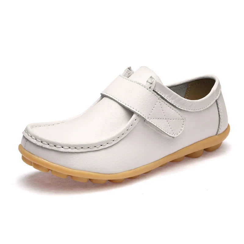 White leather casual loafer with stitched details and beige rubber sole on white background