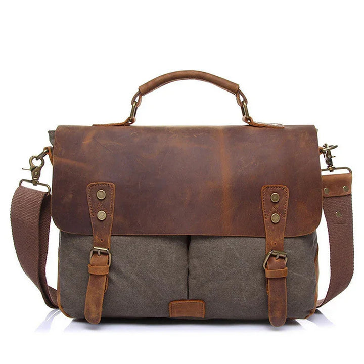 brown leather and canvas messenger bag with adjustable strap and top handle