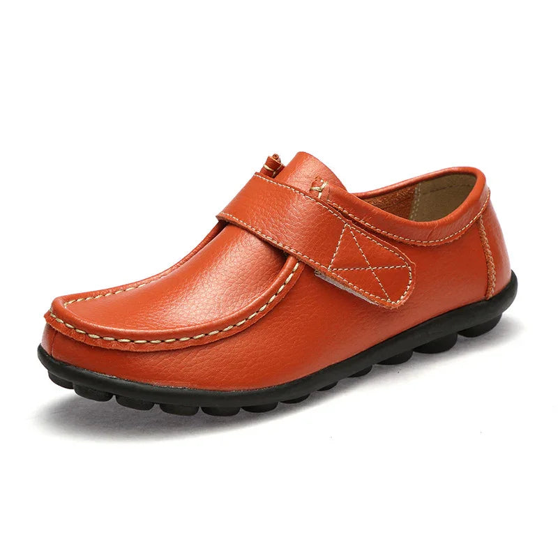 Orange leather casual moccasin shoe with stitched details and black rubber sole