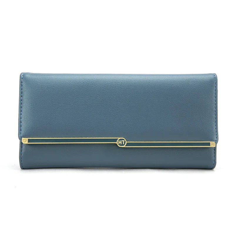 Elegant blue leather wallet with gold HT logo bar detail on white background
