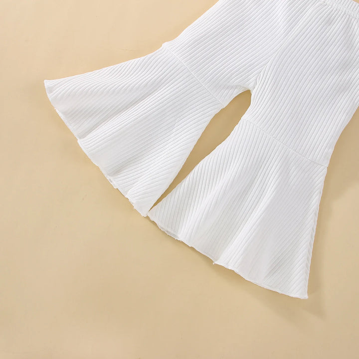 White ribbed knit fabric with flared bell sleeves design on beige background