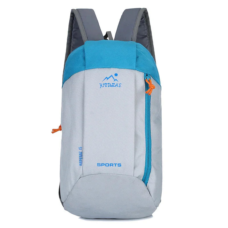 Light grey and blue sports backpack with orange zipper pull, front view