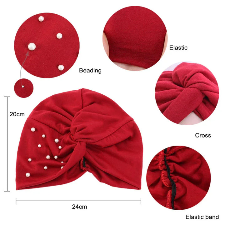 Red turban headwear with pearl beading, elastic band, and cross knot design measuring 24x20cm