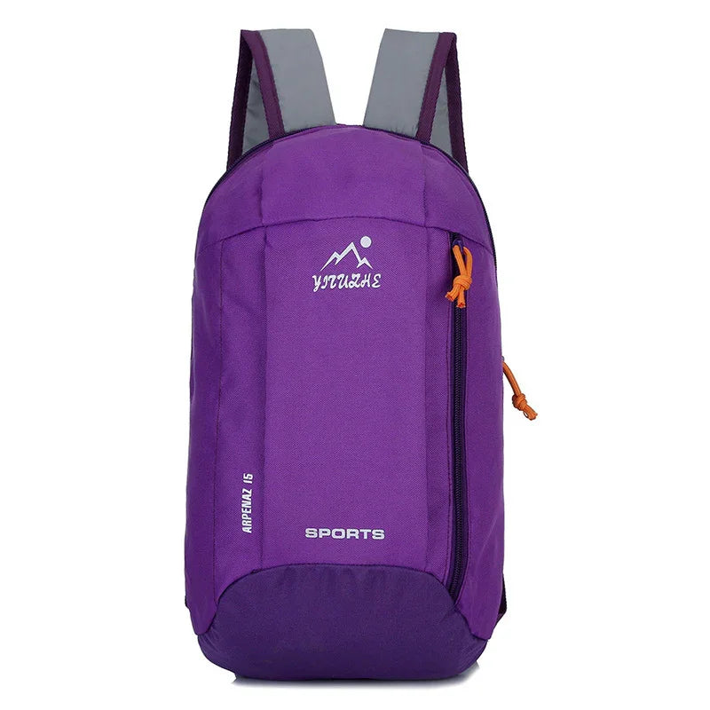 Purple sports backpack with front zipper pocket and grey shoulder straps on white background