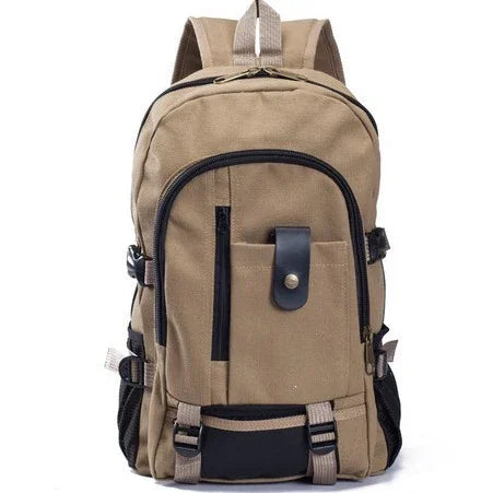 Beige canvas backpack with black zipper pockets, adjustable straps, and front flap pocket