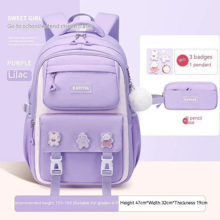 Lilac purple Karissa backpack with front pockets, cute bear badges, white pompom, and matching pencil case