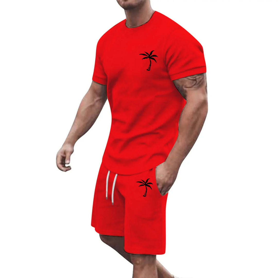 Muscular man wearing red casual short sleeve t-shirt and shorts set with black palm tree prints