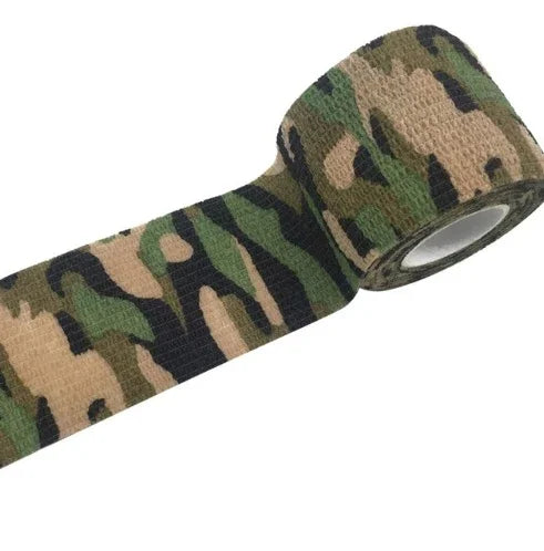 Camouflage cohesive bandage wrap roll with green, tan, and black pattern on white background