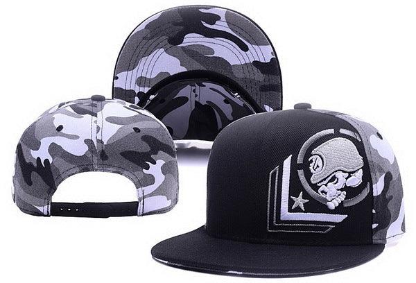 Black and gray camo snapback cap with embroidered astronaut skull logo on front panel