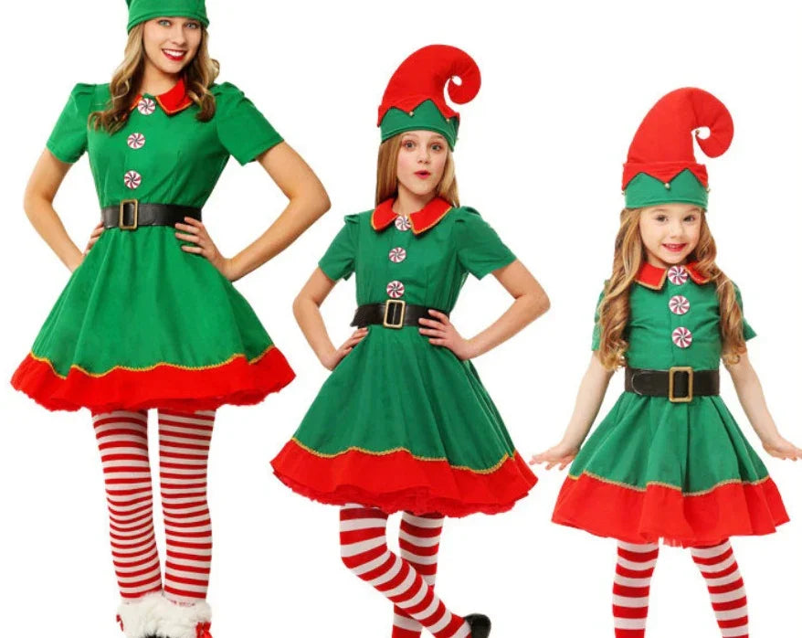 Three females in green and red Christmas elf dresses with striped tights and festive hats