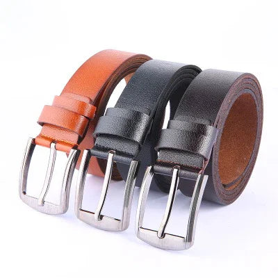 Three leather belts in brown, black, and dark brown with silver metal buckles arranged side by side