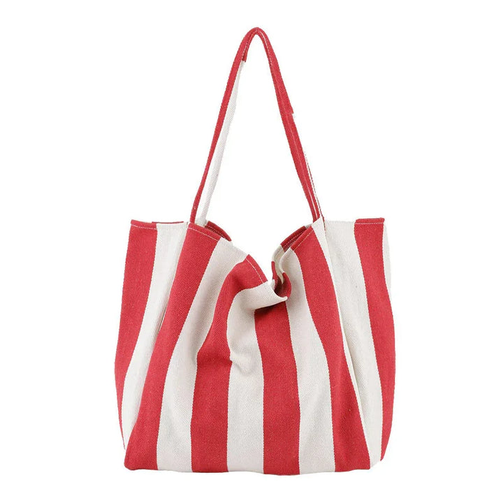 Red and white striped canvas tote bag with long handles on white background