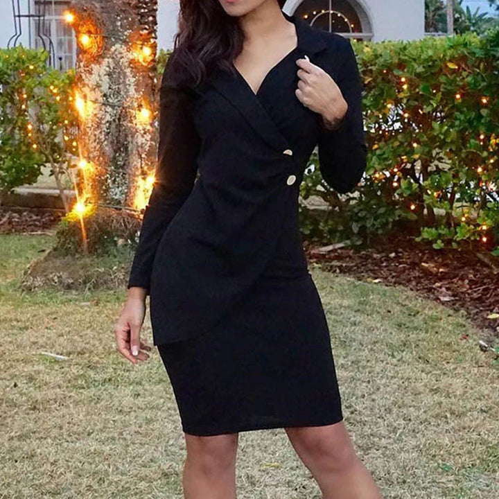 Woman wearing a chic black long-sleeve dress with gold buttons in a garden lit by string lights