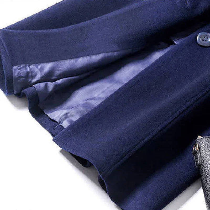 Close-up of a navy blue wool coat with smooth inner lining and visible button detail