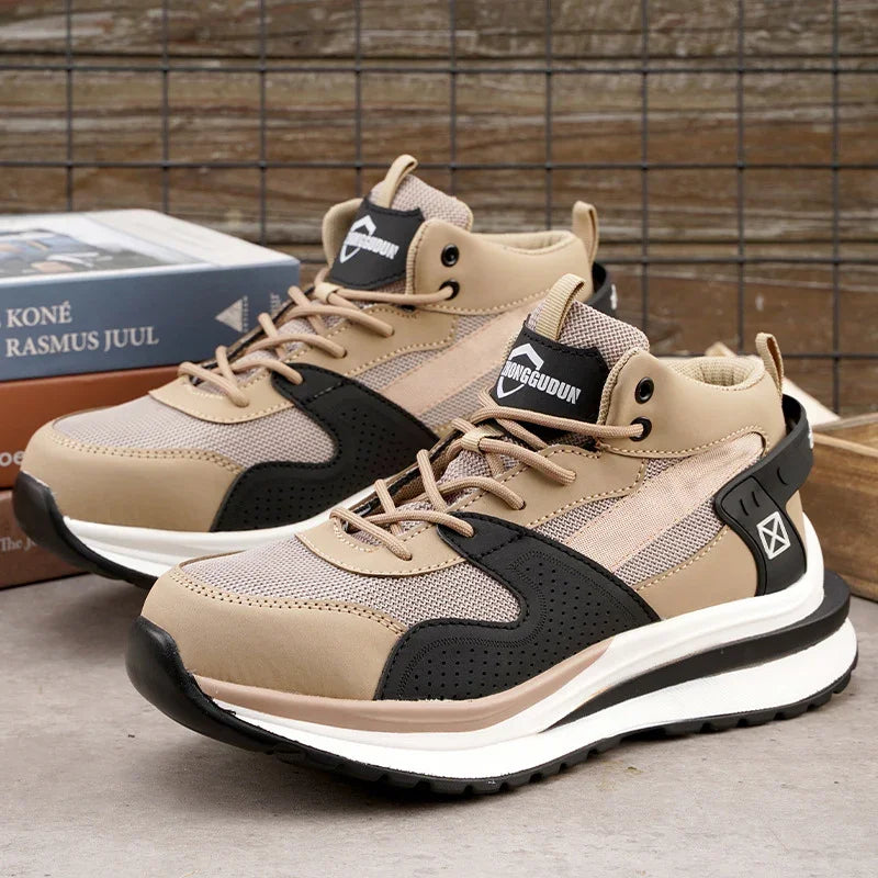 Beige and black casual sport sneakers with mesh and leather detail on concrete floor against rustic wooden background