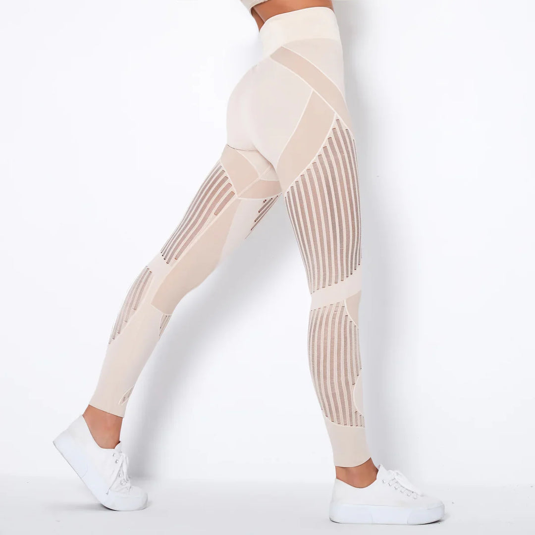 Woman wearing beige high-waisted seamless leggings with mesh panels and white sneakers