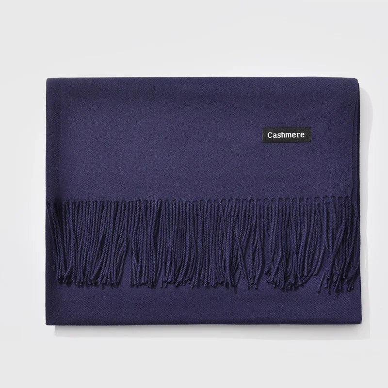 Folded navy blue cashmere scarf with fringe detailing and cashmere label