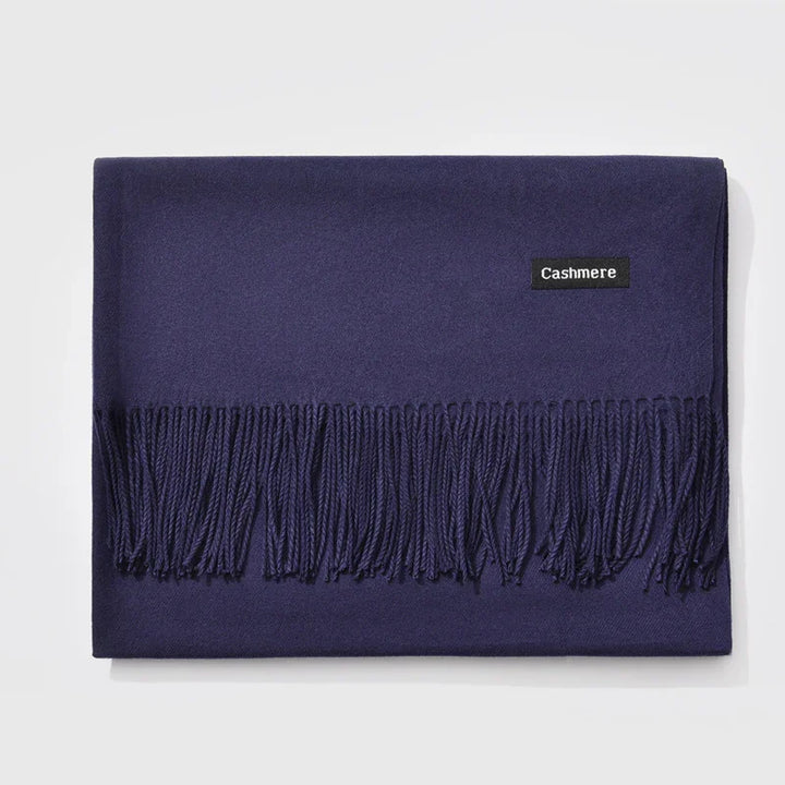 Folded navy blue cashmere scarf with fringe detailing and cashmere label