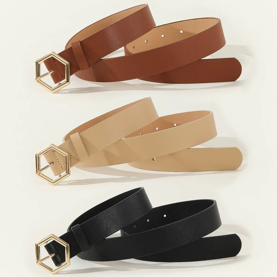 Set of brown, beige, and black leather belts with gold hexagon buckles on white background