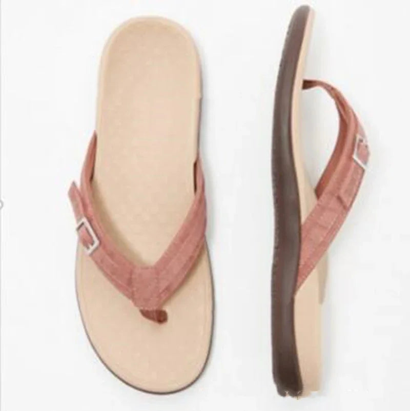 beige flip-flops with brown fabric straps and adjustable buckles, cushioned sole
