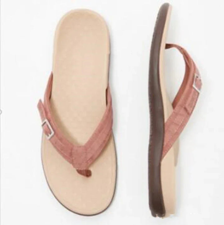 beige flip-flops with brown fabric straps and adjustable buckles, cushioned sole
