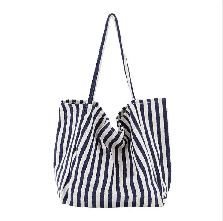 Blue and white striped canvas tote bag with long shoulder straps