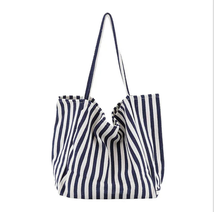 Blue and white striped canvas tote bag with long shoulder straps