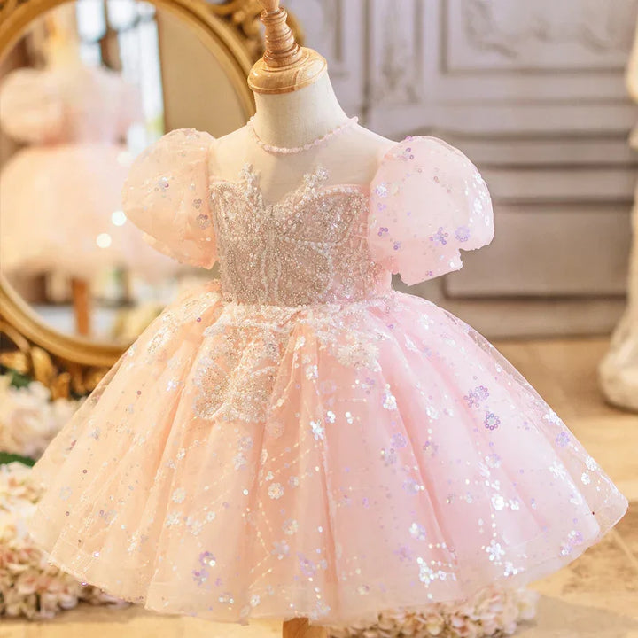 Pink glittery toddler princess dress with puff sleeves and butterfly embellishments