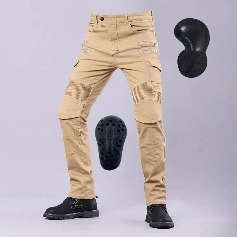 Beige motorcycle riding pants with reinforced padding inserts and black boots on gray background