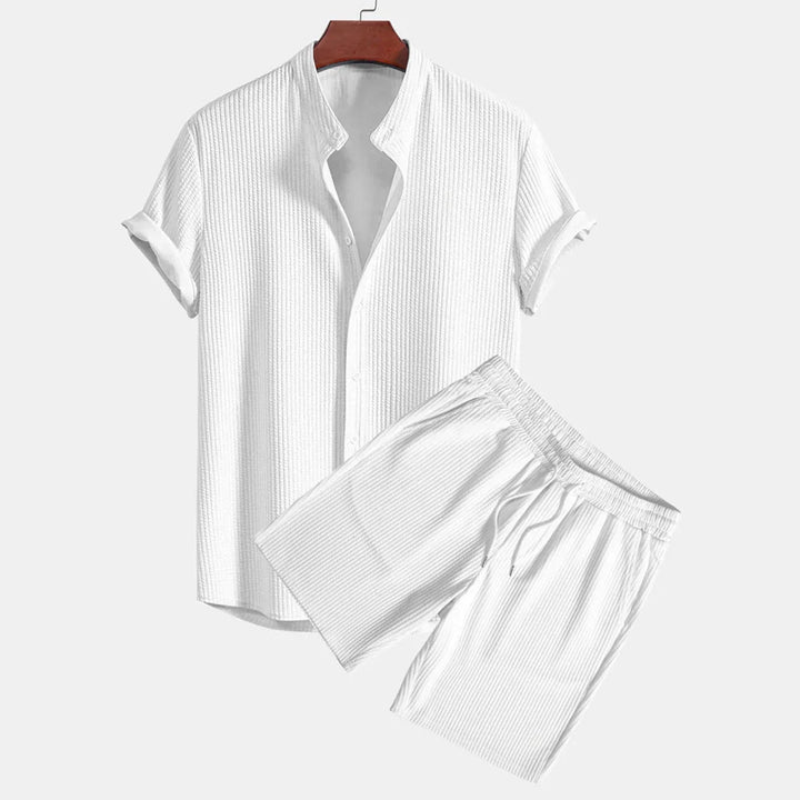 White short-sleeve textured button-up shirt on hanger with matching drawstring shorts