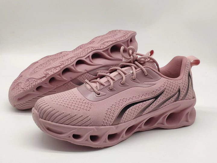Pair of pink breathable mesh running shoes with unique hollow sole design and black accents