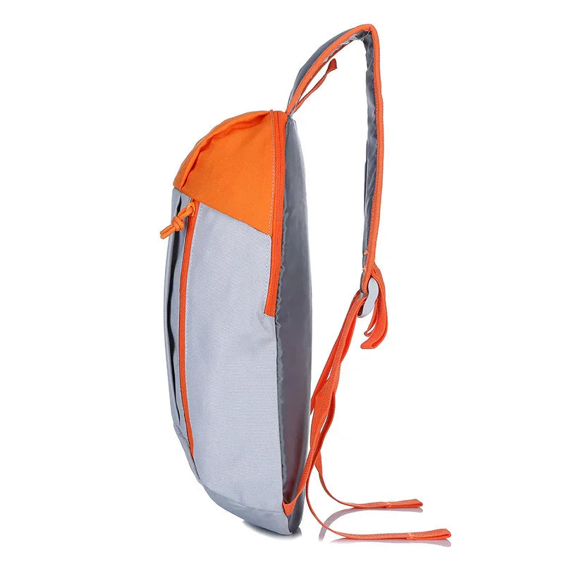 Slim light gray and orange backpack with single strap and front zipper pocket